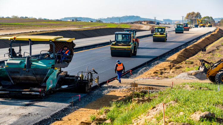 Road rollers building the new asphalt road